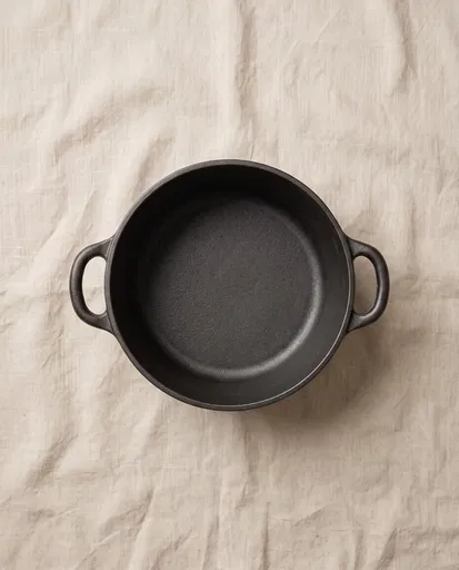 Overhead Black Cast Iron Pot on Linen