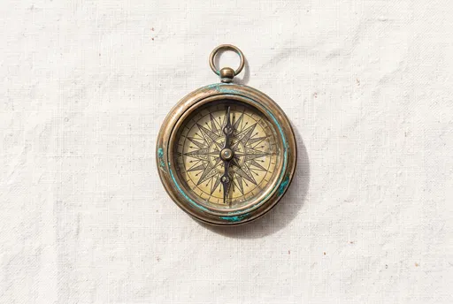 Vintage Bronze Compass on White Linen