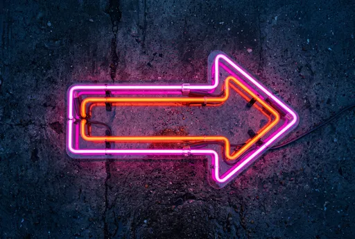 Glowing Pink and Orange Neon Arrow