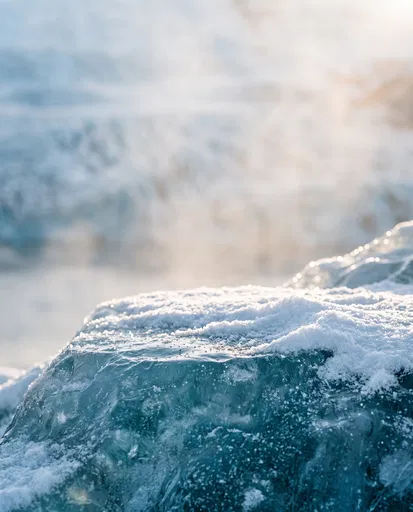Sunlit Glacial Ice Ledge With Snow
