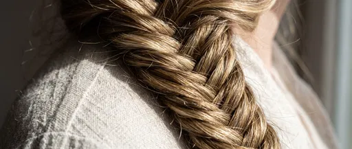 Close-Up of Highlighted Blonde Braid on Shoulder