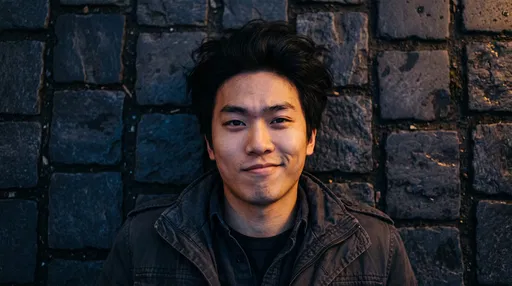 Young Man Smirking on Cobblestones