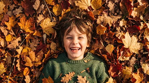 Smiling Child Lying in Autumn Leaves