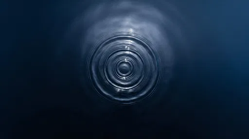Concentric Ripples on Dark Blue Water