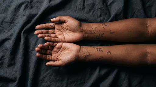 Black Woman Hands With Minimalist Fine Line Tattoos