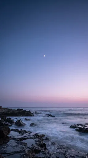 Crescent Moon Over Twilight Coast