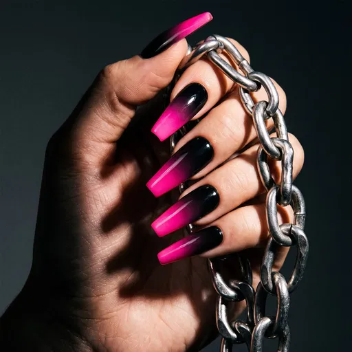 Hand With Pink Ombre Nails Holding Chain