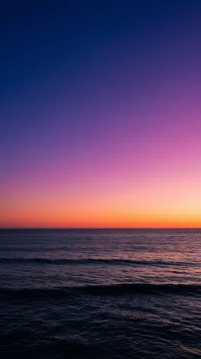 Vibrant Twilight Sky Over Ocean Horizon
