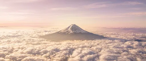 Volcanic Peak Above Sunrise Clouds